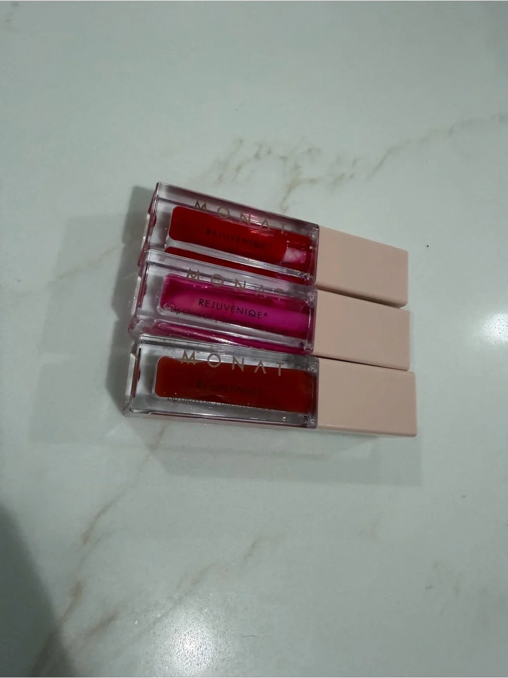 Monat Rejuveniqe Lip Gloss Oil Trio — Red, Pink, Coral Shades